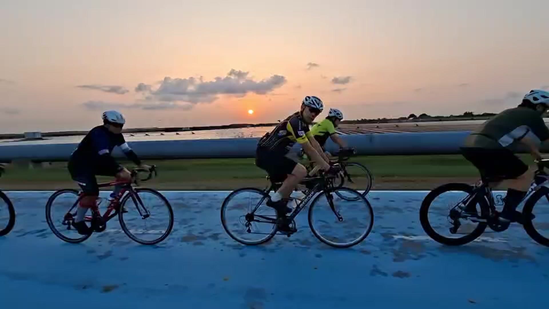 Cyclists riding the Skylane at golden hour